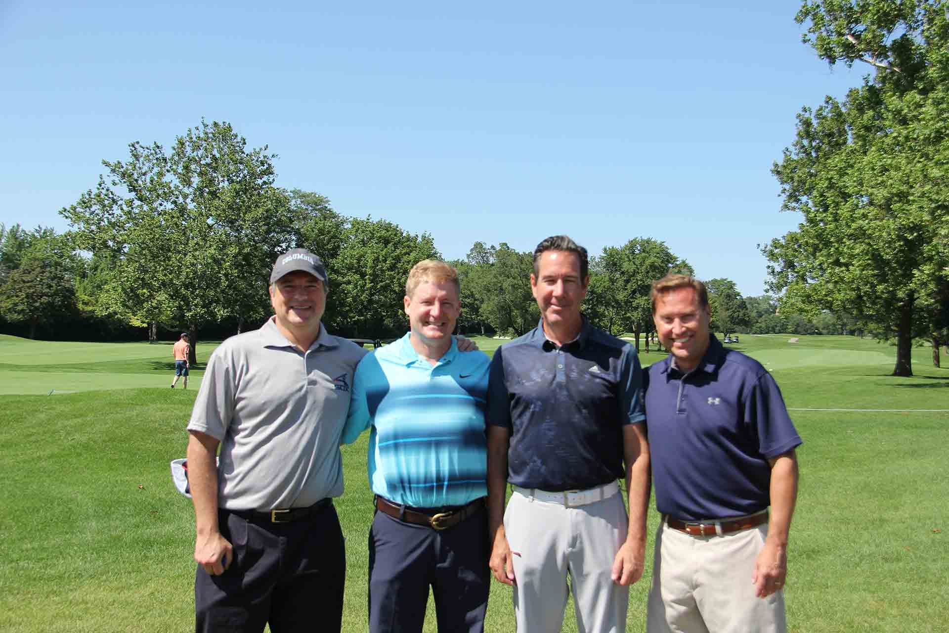 marist-law-association-golf-outing-four-golfers-smiling-together