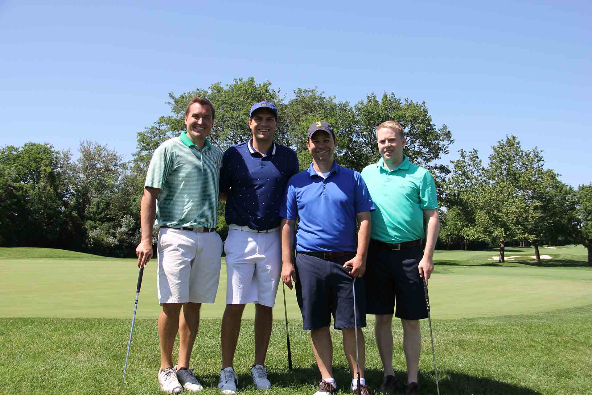 marist-law-association-golf-outing-four-golfers-smiling