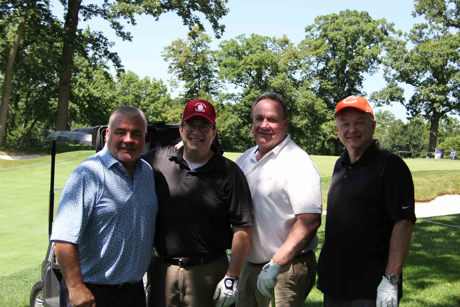 marist-law-association-golf-outing-four-golfers-under-a-tree