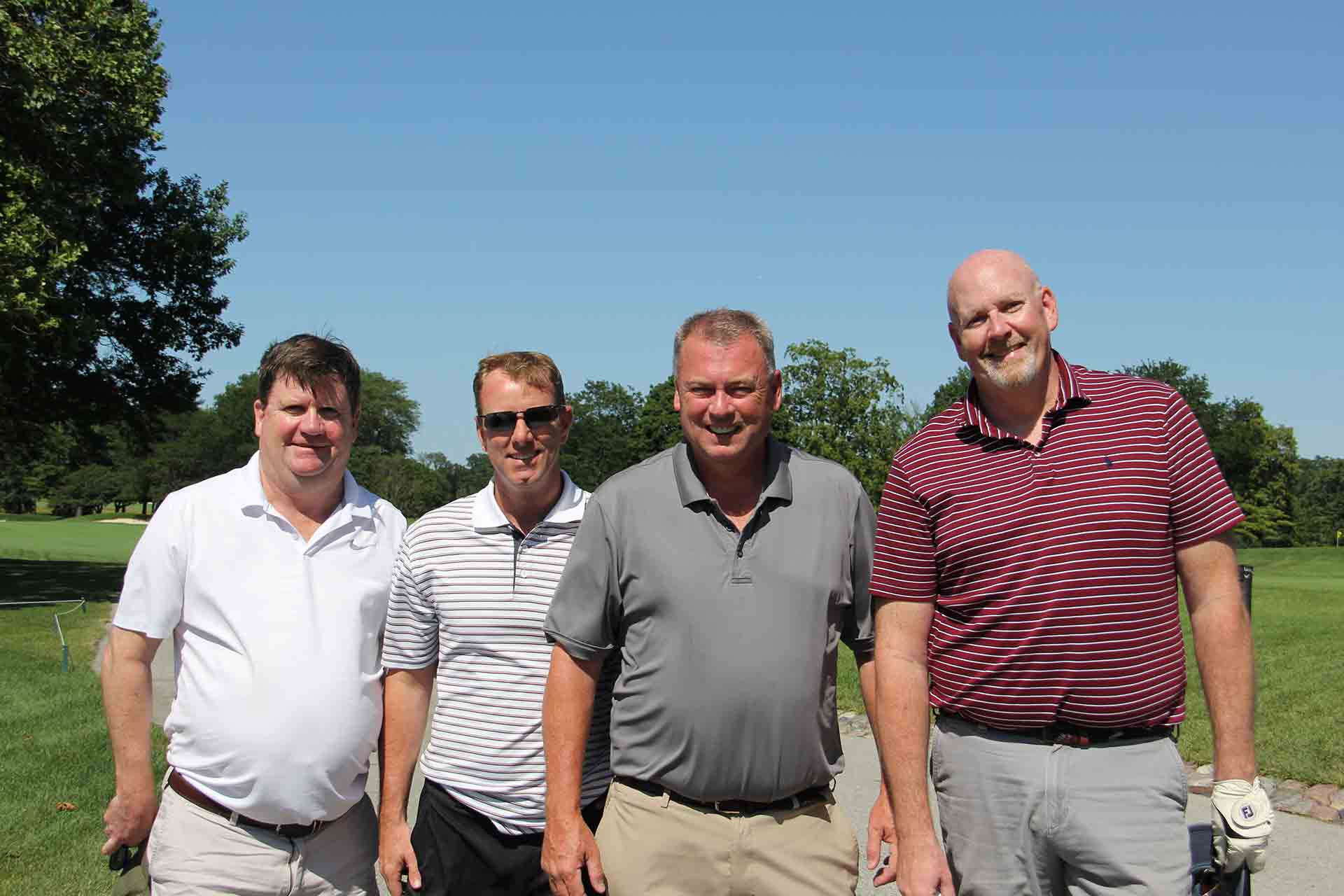 marist-law-association-golf-outing-four-men-smiling