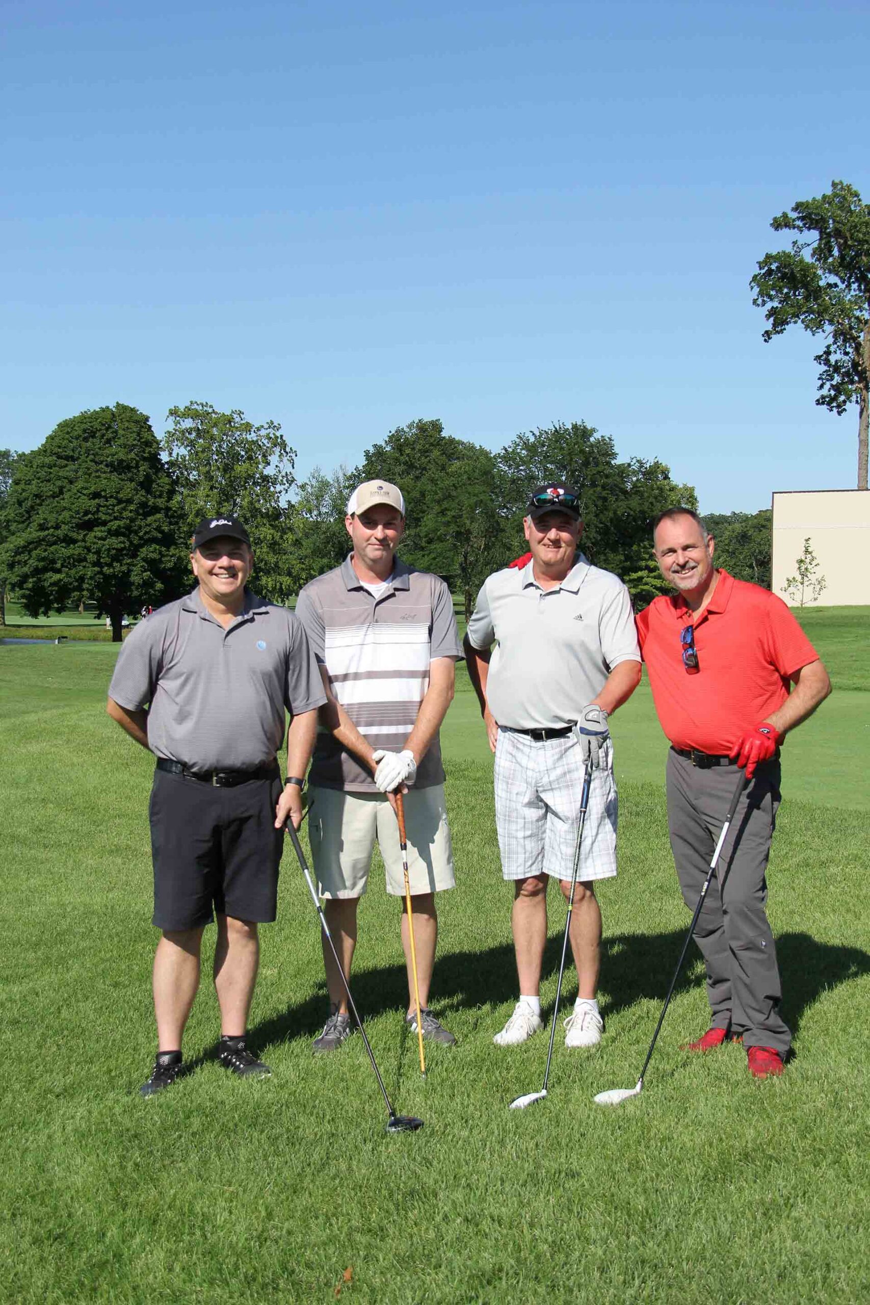 marist-law-association-golf-outing-four-people-smiling