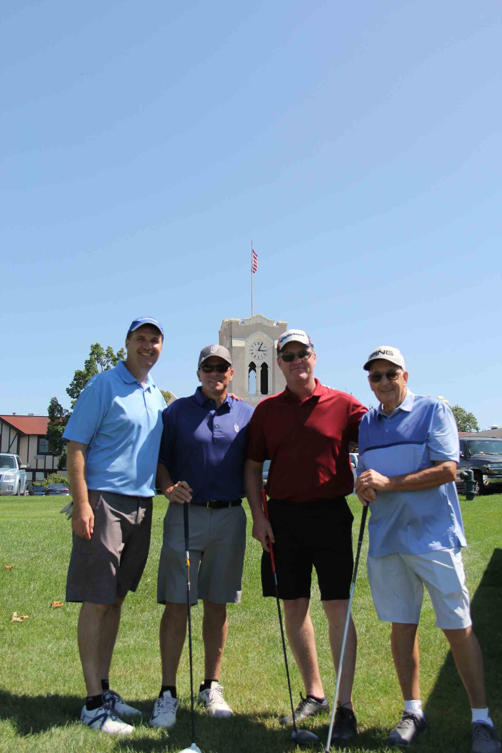 marist-law-association-golf-outing-golfers-staning-in-front-of-clock