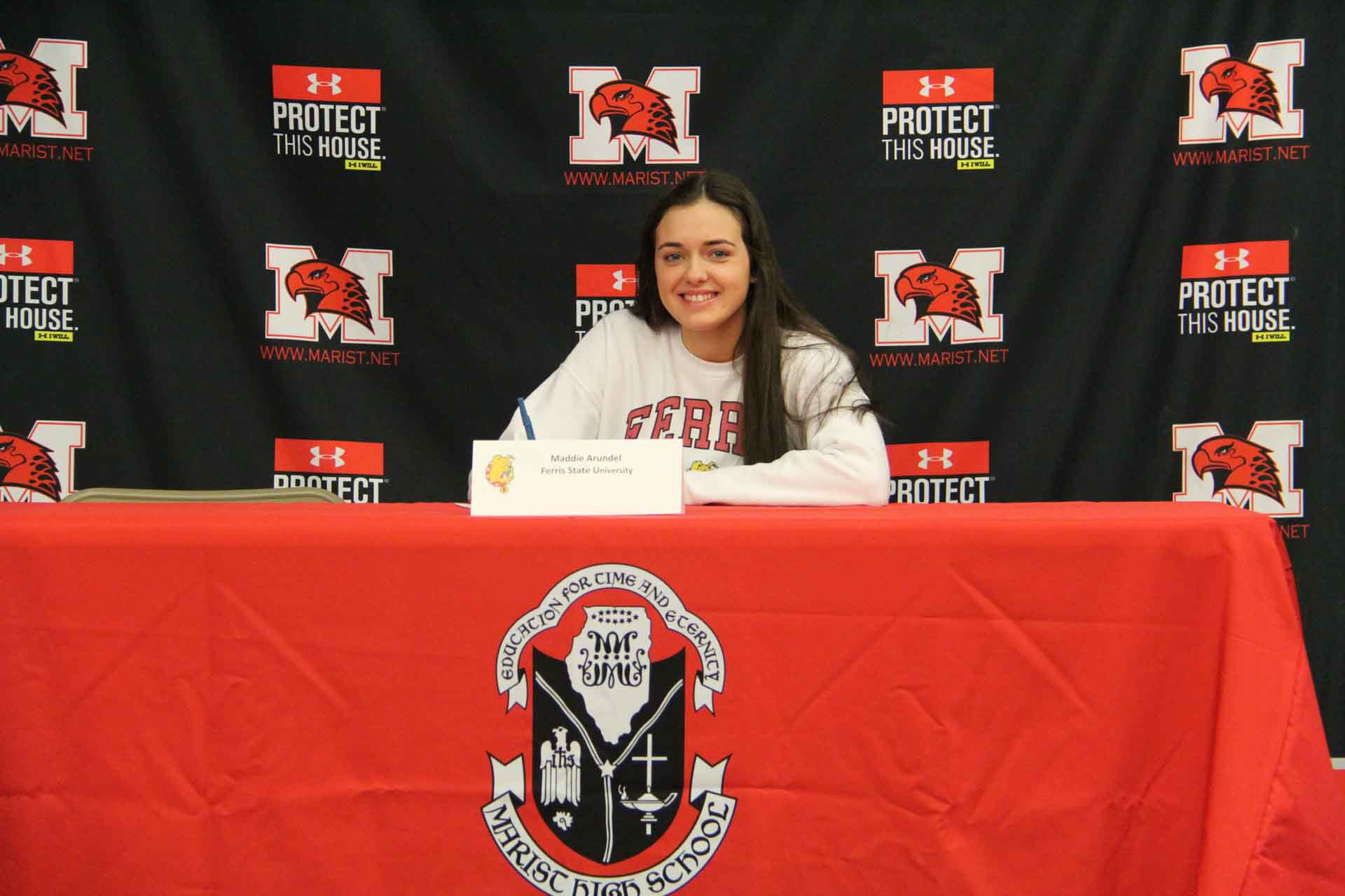 nli-signing-november-2019-person-smiles-signing-to-ferris-state