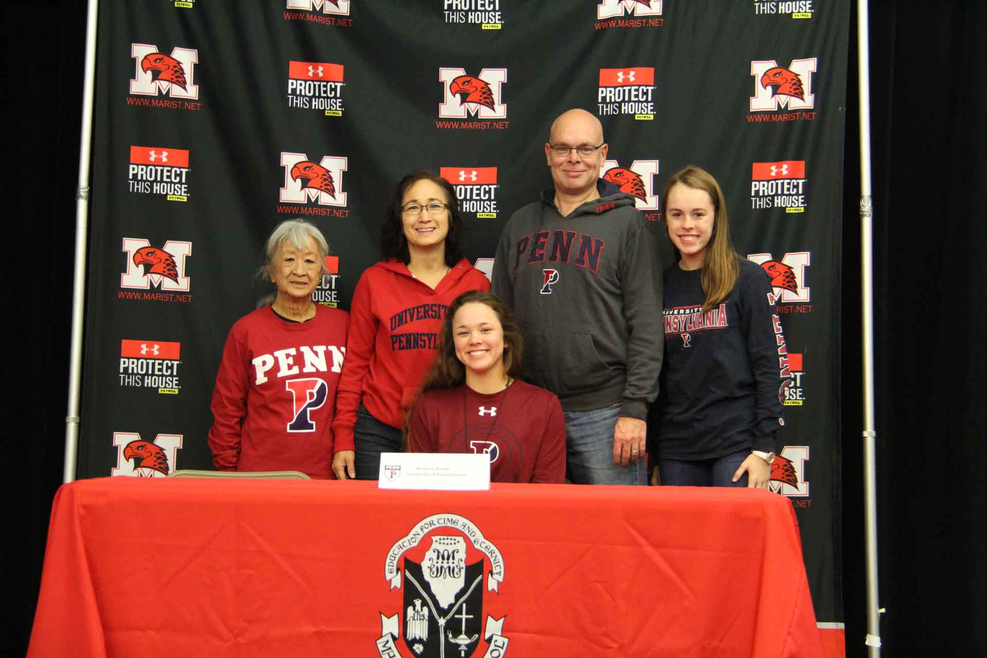 nli-signing-november-2019-person-smiles-with-family
