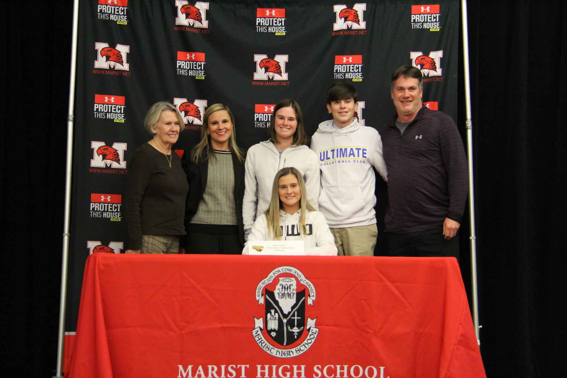 nli-signing-november-2019-person-with-family-at-signing