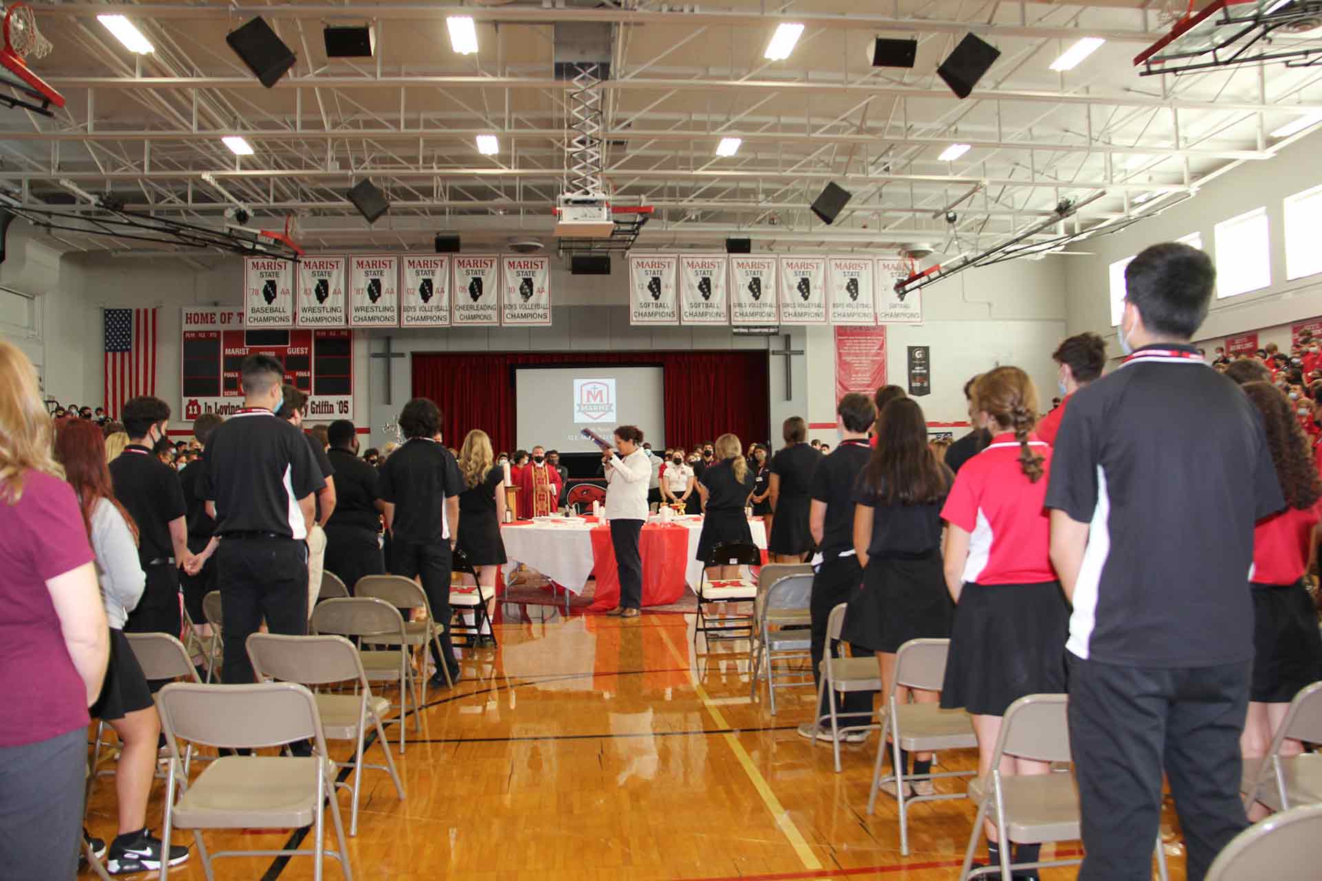school-mass-9-15-2021-students-standing-for-mass-in-gym