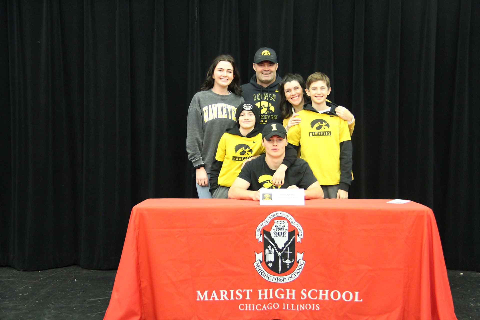 student-and-family-at-signing