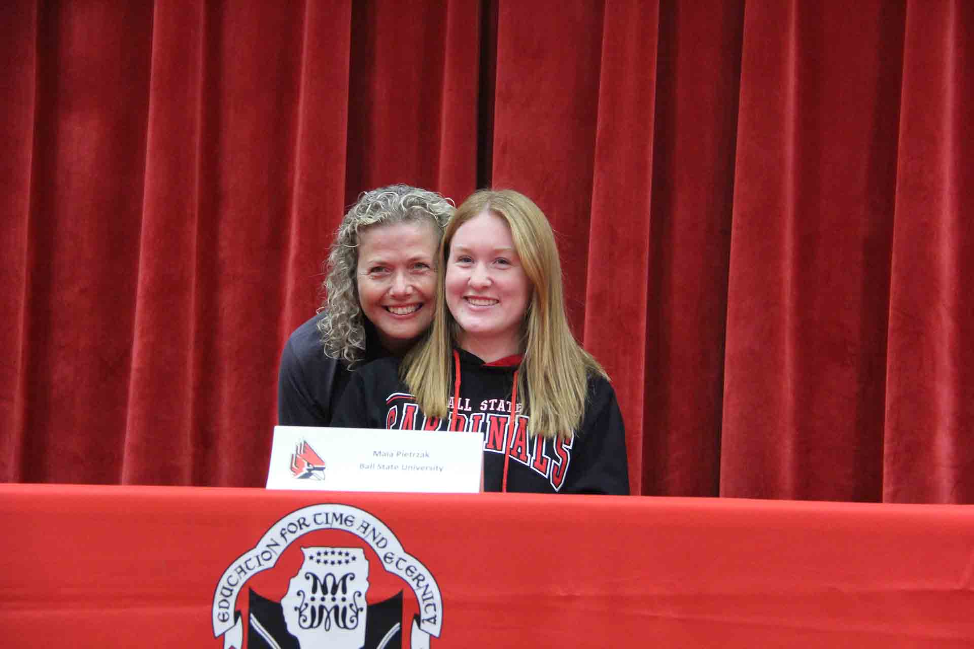 student-and-parent-at-college-signing-for-ball-state