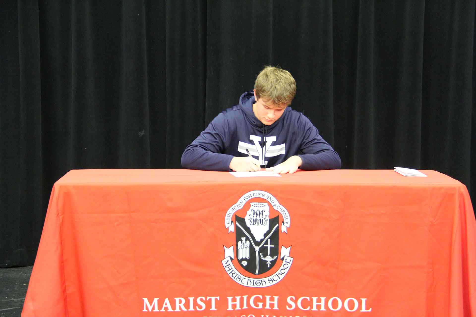 student-of-marist-at-college-signing