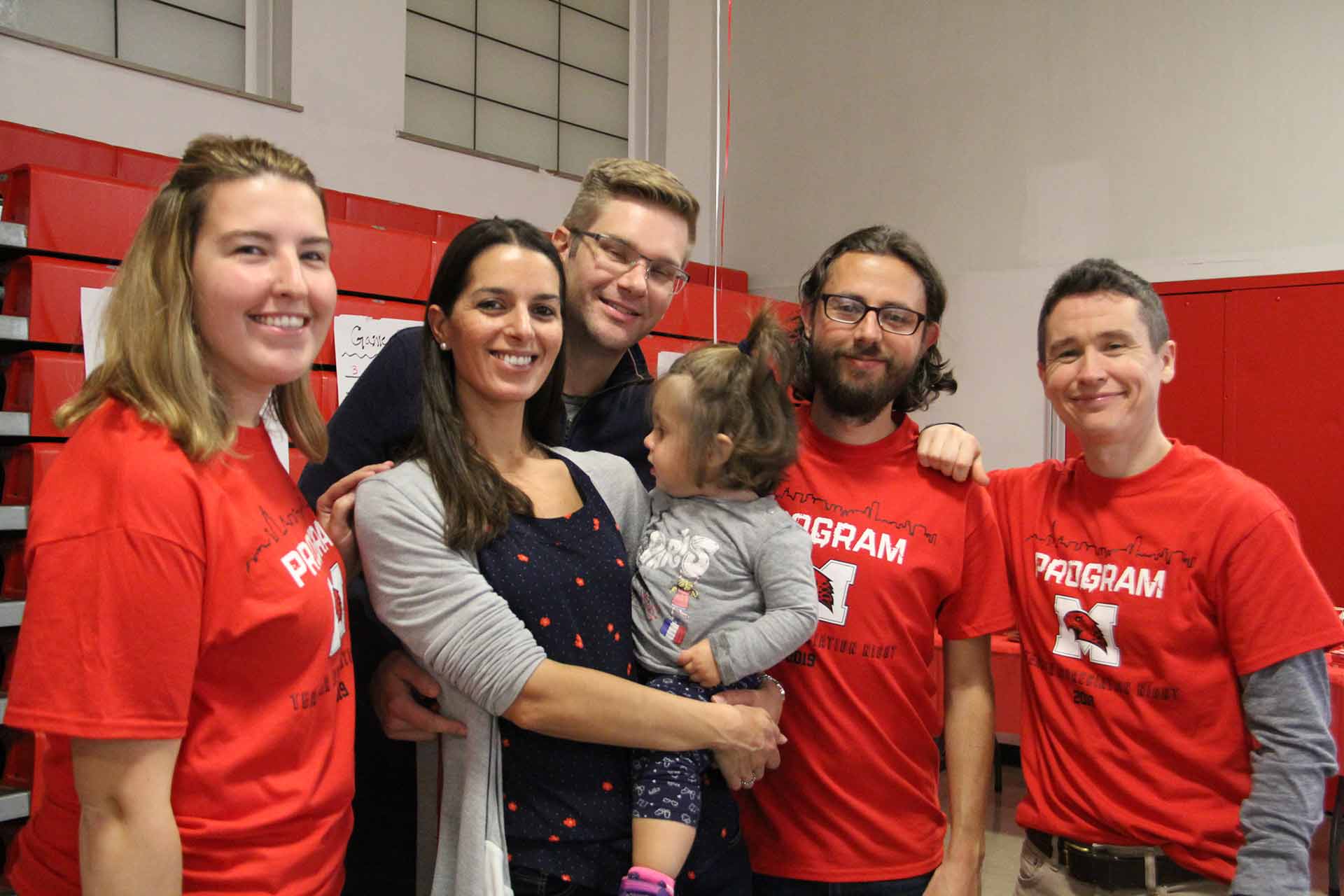 volleyball-vs-benet-teacher-appreciation-five-people-smiling-with-baby
