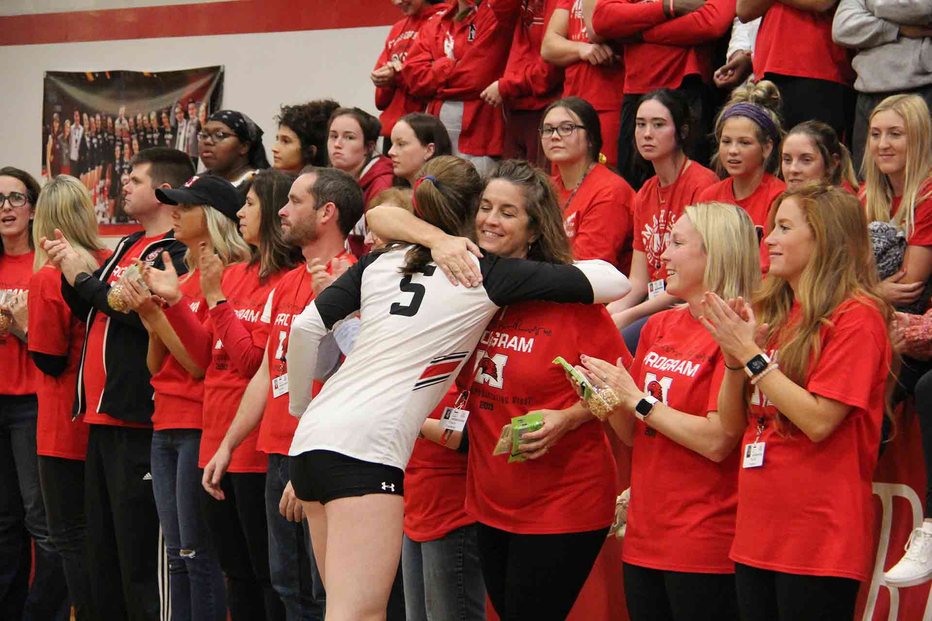 volleyball-vs-benet-teacher-appreciation-teacher-smiling-and-hugging-student